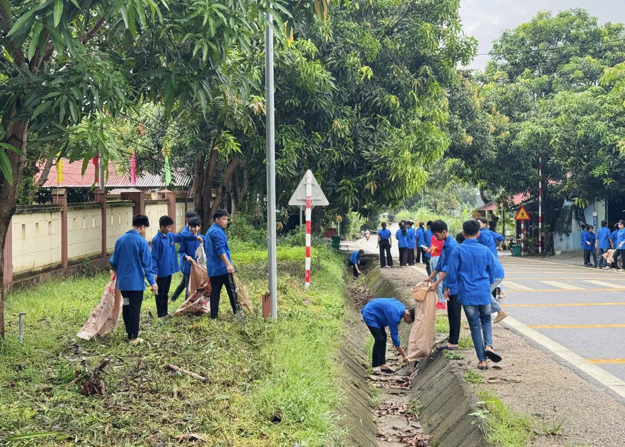 Cán bộ và đoàn viên Xuân Hòa tham gia dọn vệ sinh dọc Quốc lộ 279. (Ảnh Truyền Hình Bảo Yên)